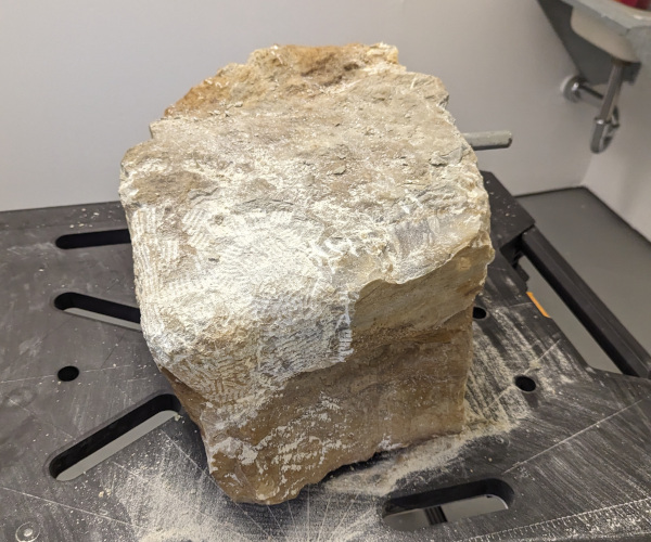 an abstract sculpture made from alabaster. it resembles a heart and a butt